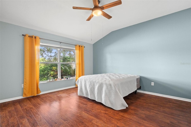 19232 Barred Owl Ct, Land O Lakes, FL 34638 - bedroom with vaulted ceiling, wood finished floors, and a ceiling fan