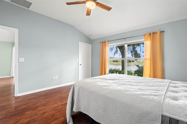 19232 Barred Owl Ct, Land O Lakes, FL 34638 - bedroom featuring wood finished floors, lofted ceiling, a water view, and a ceiling fan
