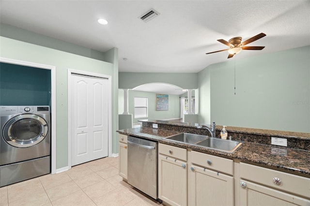 19232 Barred Owl Ct, Land O Lakes, FL 34638 - kitchen featuring dishwasher, washer / clothes dryer, arched walkways, ceiling fan, and light tile patterned floors