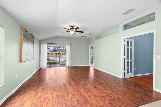 19232 Barred Owl Ct, Land O Lakes, FL 34638 - empty room featuring wood finished floors, a ceiling fan, and vaulted ceiling