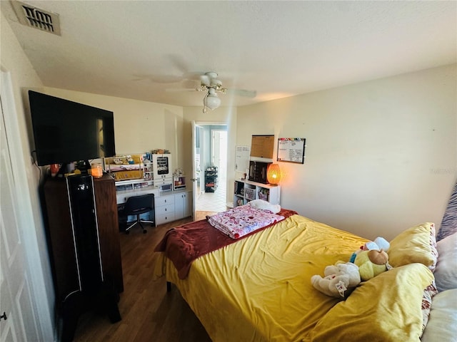 14334 Teasdale Ave, Hudson, FL 34667 - bedroom featuring wood finished floors, a ceiling fan, and a desk
