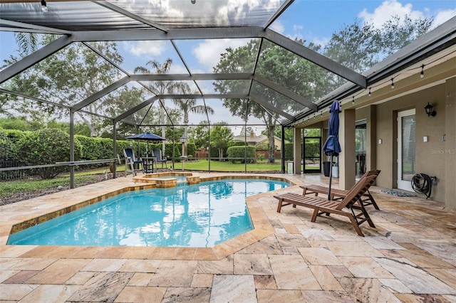 view of swimming pool with a patio area and a pool with connected hot tub