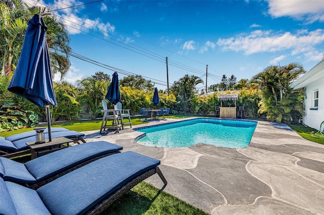 outdoor pool with a patio and fence