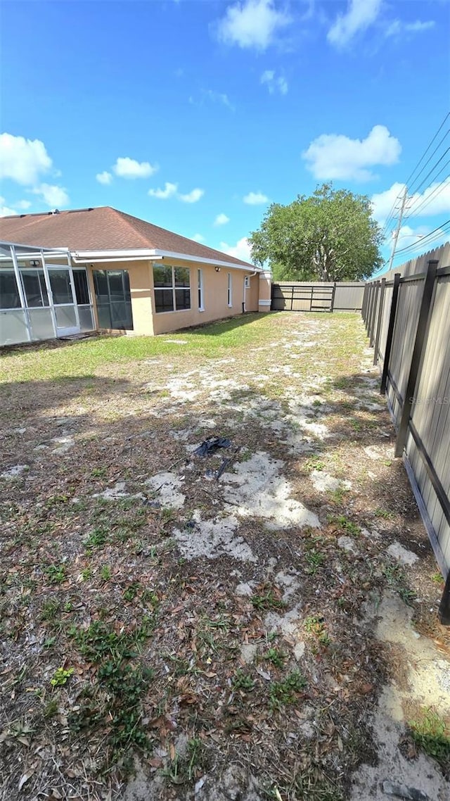 view of yard with a fenced backyard