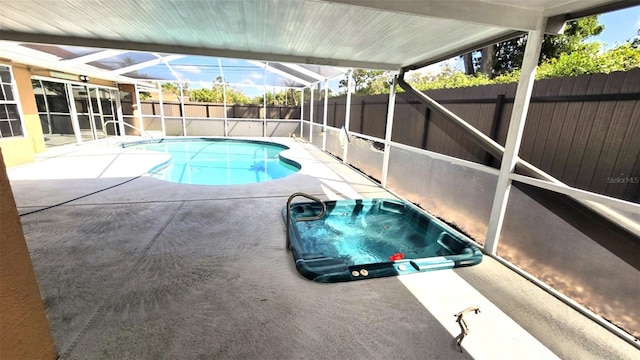 view of pool with a lanai, a fenced backyard, a fenced in pool, and a patio area