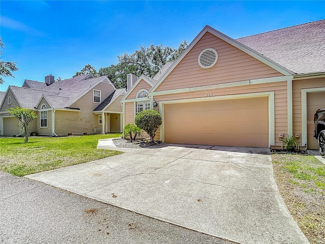 3611 Pine Knot Dr, Valrico, FL 33596 - traditional-style house featuring a garage, a front lawn, and concrete driveway