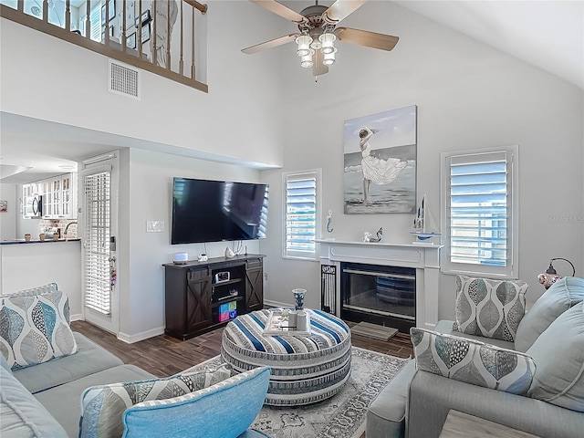 3611 Pine Knot Dr, Valrico, FL 33596 - living room with ceiling fan, visible vents, baseboards, wood finished floors, and high vaulted ceiling