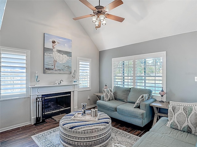 3611 Pine Knot Dr, Valrico, FL 33596 - living area featuring wood finished floors, ceiling fan, baseboards, high vaulted ceiling, and a fireplace with flush hearth