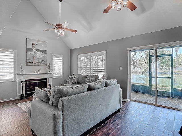 3611 Pine Knot Dr, Valrico, FL 33596 - living room with baseboards, wood finished floors, a ceiling fan, and lofted ceiling