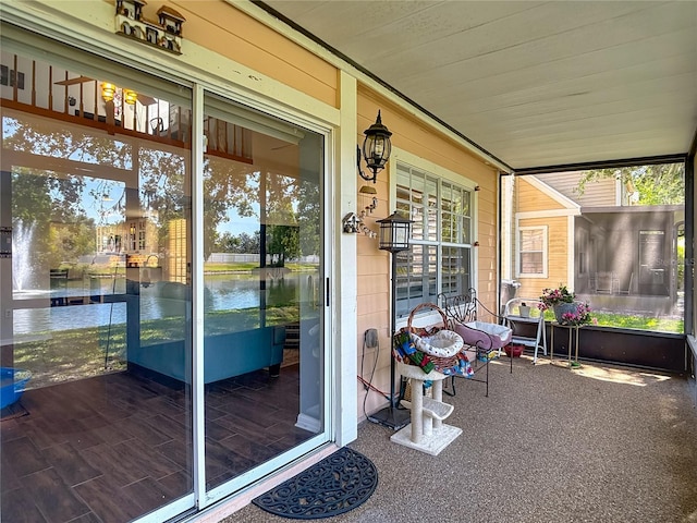 3611 Pine Knot Dr, Valrico, FL 33596 - doorway to property with a porch and a water view