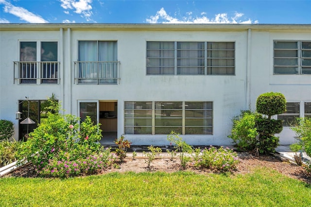 1655 S Highland Ave Unit D140, Clearwater, FL 33756 - view of front of property featuring stucco siding