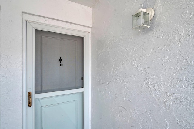 1655 S Highland Ave Unit D140, Clearwater, FL 33756 - doorway to property featuring stucco siding