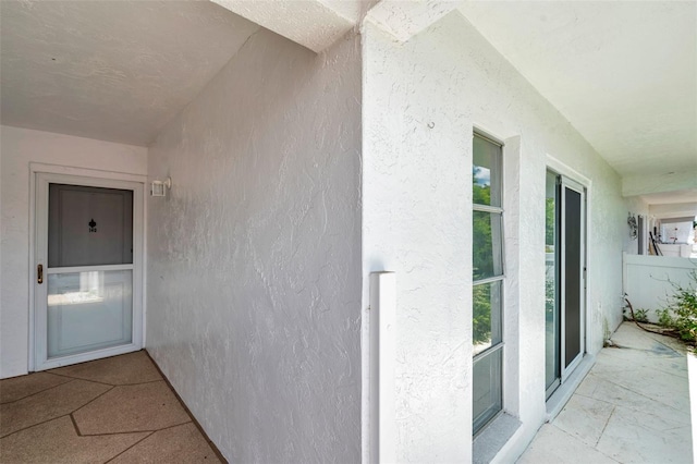 1655 S Highland Ave Unit D140, Clearwater, FL 33756 - doorway to property with stucco siding