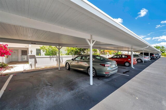 1655 S Highland Ave Unit D140, Clearwater, FL 33756 - covered parking lot with fence