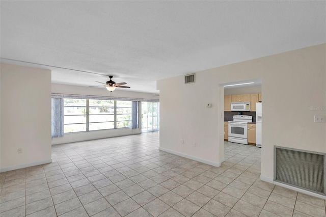 1655 S Highland Ave Unit D140, Clearwater, FL 33756 - unfurnished living room with baseboards, ceiling fan, and light tile patterned flooring