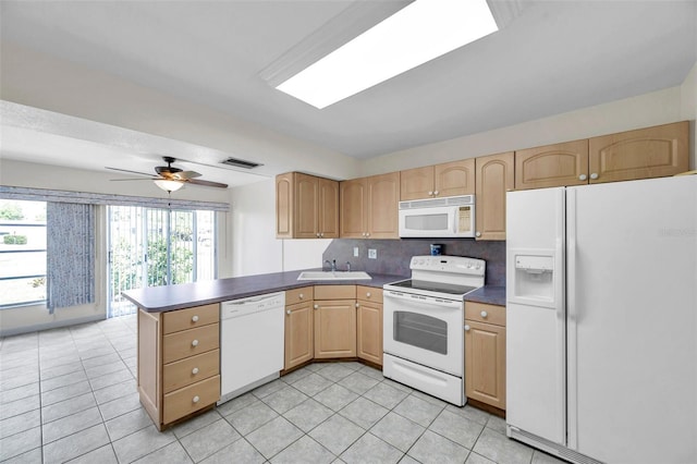 1655 S Highland Ave Unit D140, Clearwater, FL 33756 - kitchen with white appliances, a peninsula, light brown cabinets, and light tile patterned floors
