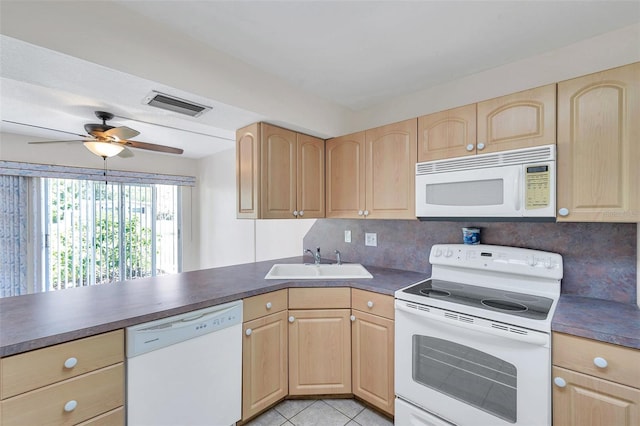 1655 S Highland Ave Unit D140, Clearwater, FL 33756 - kitchen with white appliances, light brown cabinets, a sink, and dark countertops