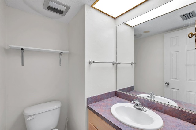 1655 S Highland Ave Unit D140, Clearwater, FL 33756 - bathroom featuring toilet and vanity