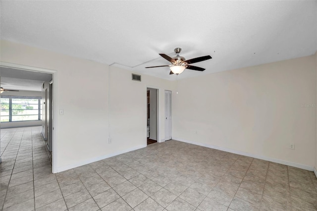 1655 S Highland Ave Unit D140, Clearwater, FL 33756 - empty room featuring a ceiling fan and baseboards