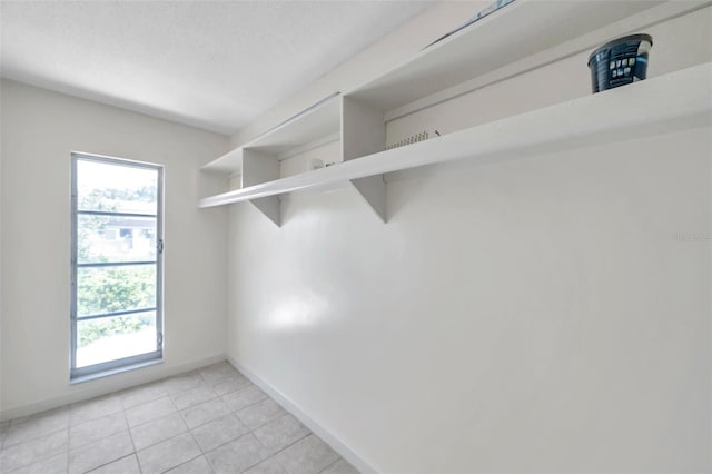 1655 S Highland Ave Unit D140, Clearwater, FL 33756 - walk in closet with light tile patterned floors