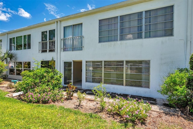 1655 S Highland Ave Unit D140, Clearwater, FL 33756 - back of house featuring stucco siding