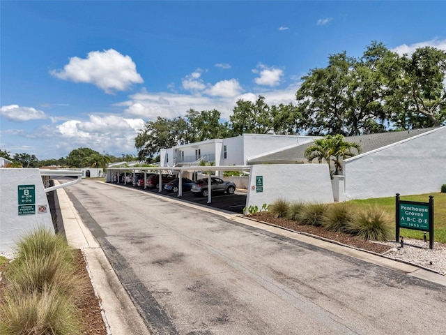 1655 S Highland Ave Unit D140, Clearwater, FL 33756 - view of asphalt road with curbs