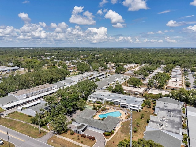 1655 S Highland Ave Unit D140, Clearwater, FL 33756 - bird's eye view of a pool and a forest