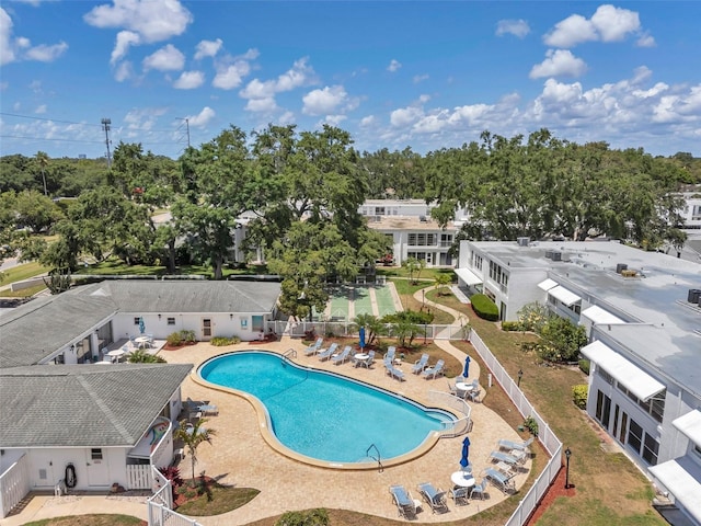 1655 S Highland Ave Unit D140, Clearwater, FL 33756 - community pool featuring fence, a patio area, and view of wooded area