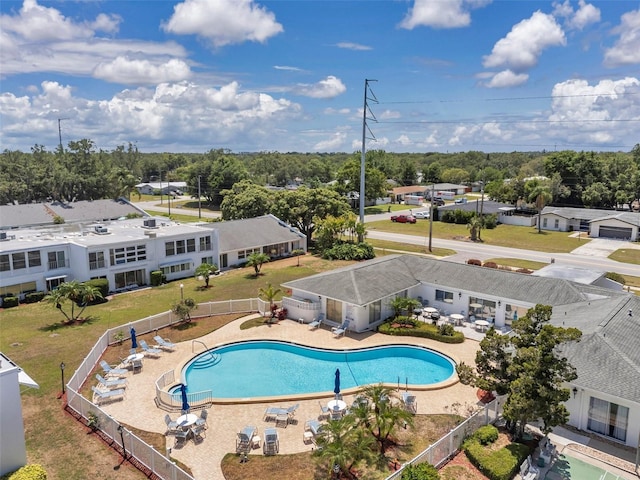 1655 S Highland Ave Unit D140, Clearwater, FL 33756 - community pool featuring fence, a patio, and view of wooded area