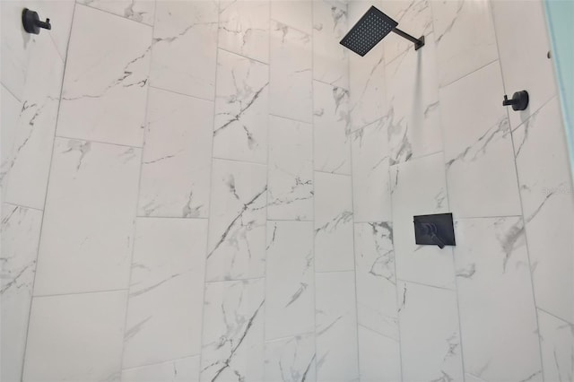 bathroom with a tile shower