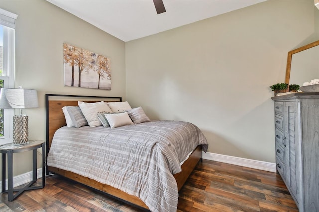 bedroom with baseboards, a ceiling fan, and wood finished floors
