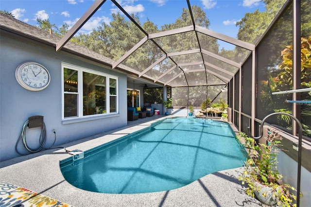 outdoor pool featuring a lanai and a patio area