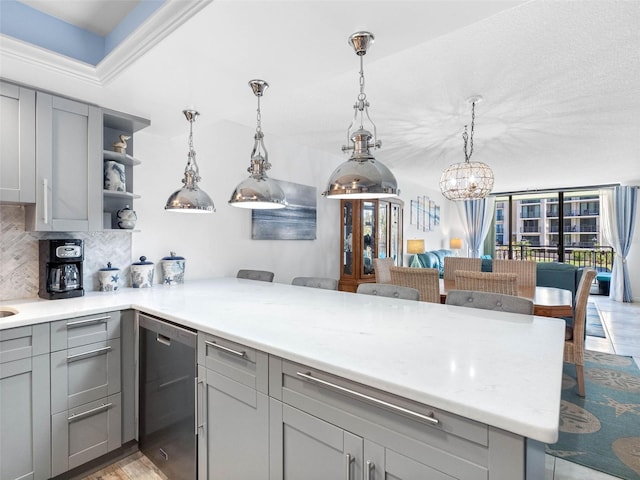 1430 Gulf Blvd Unit 102, Clearwater Beach, FL 33767 - kitchen with tasteful backsplash, a peninsula, open shelves, gray cabinets, and light countertops