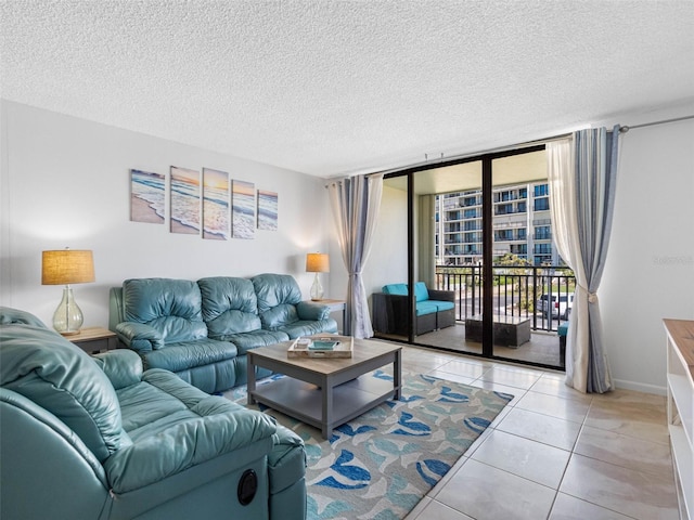 1430 Gulf Blvd Unit 102, Clearwater Beach, FL 33767 - living area featuring light tile patterned floors, a textured ceiling, and baseboards