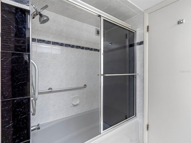 1430 Gulf Blvd Unit 102, Clearwater Beach, FL 33767 - bathroom featuring combined bath / shower with glass door