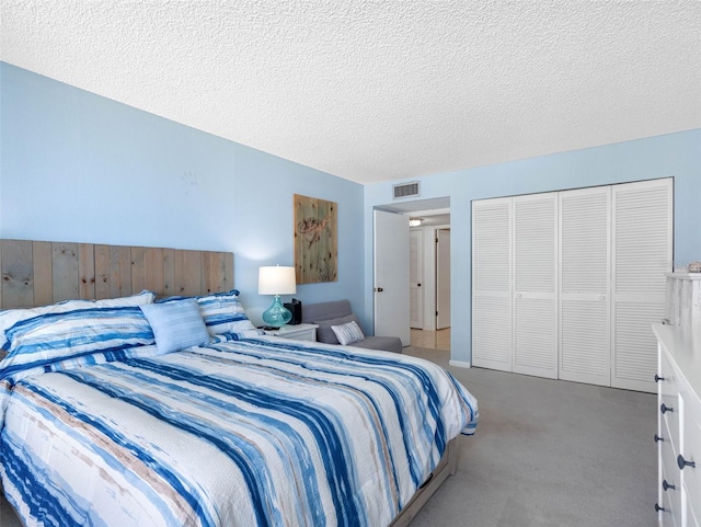 1430 Gulf Blvd Unit 102, Clearwater Beach, FL 33767 - carpeted bedroom with a textured ceiling, a closet, and visible vents
