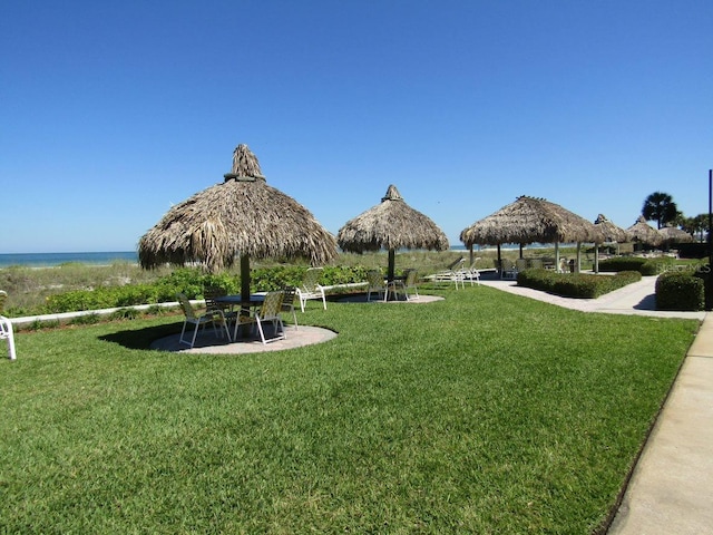 1430 Gulf Blvd Unit 102, Clearwater Beach, FL 33767 - surrounding community with a patio, a gazebo, and a lawn