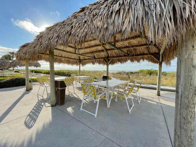 1430 Gulf Blvd Unit 102, Clearwater Beach, FL 33767 - view of patio featuring a gazebo and outdoor dining area