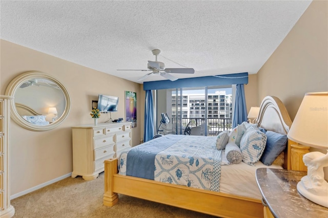 1460 Gulf Blvd Unit 406, Clearwater Beach, FL 33767 - bedroom with light carpet, baseboards, a textured ceiling, and ceiling fan