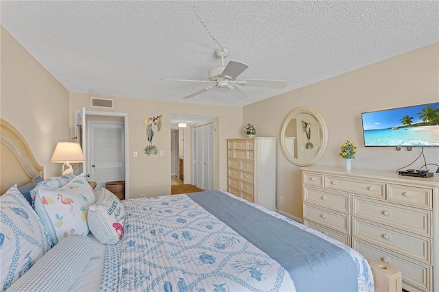 1460 Gulf Blvd Unit 406, Clearwater Beach, FL 33767 - bedroom featuring a textured ceiling, a closet, a ceiling fan, and visible vents