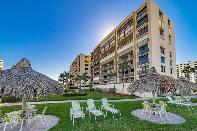 1460 Gulf Blvd Unit 406, Clearwater Beach, FL 33767 - view of home's community with a patio area and a lawn