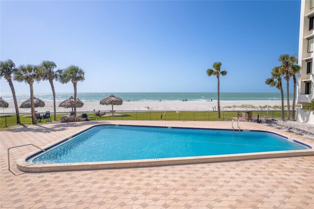 1460 Gulf Blvd Unit 406, Clearwater Beach, FL 33767 - pool with a patio, a beach view, fence, and a water view