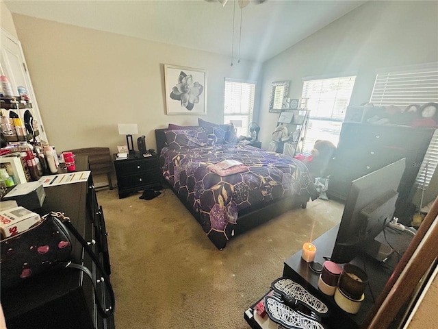 carpeted bedroom featuring vaulted ceiling