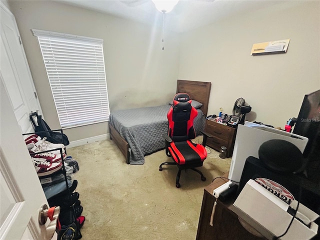carpeted bedroom with baseboards