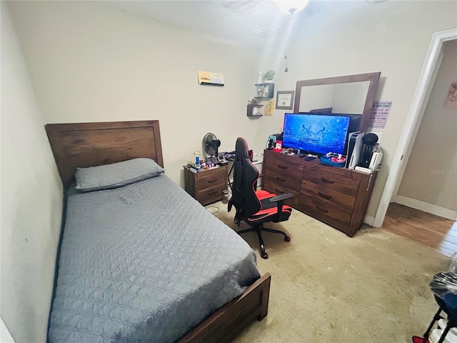carpeted bedroom featuring baseboards