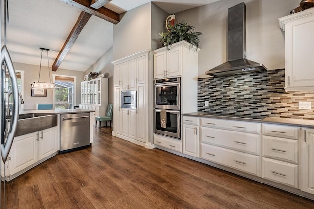 25601 Hutcheson Ln, Sorrento, FL 32776 - kitchen with stainless steel appliances, decorative backsplash, dark wood-type flooring, wall chimney exhaust hood, and white cabinets