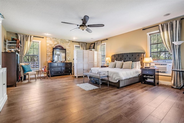 25601 Hutcheson Ln, Sorrento, FL 32776 - bedroom featuring a textured ceiling, hardwood / wood-style floors, and multiple windows