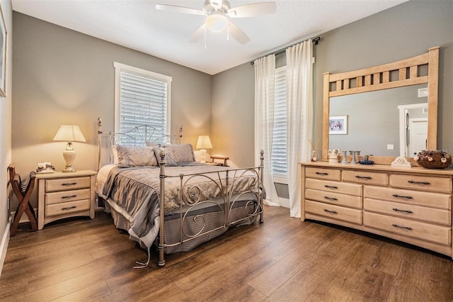 25601 Hutcheson Ln, Sorrento, FL 32776 - bedroom with ceiling fan, dark wood-style floors, and baseboards