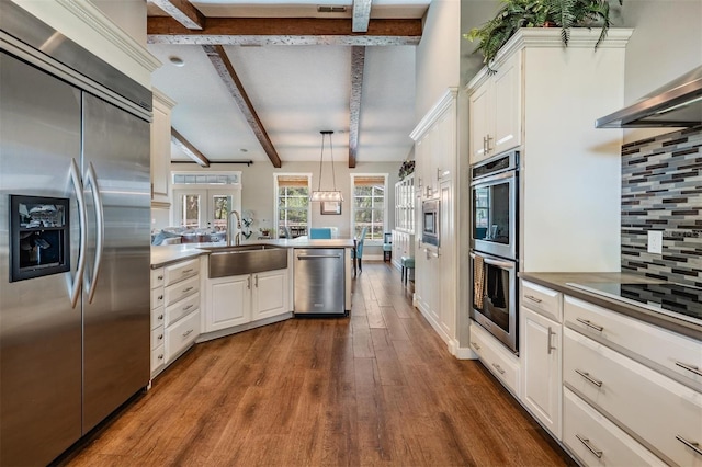 25601 Hutcheson Ln, Sorrento, FL 32776 - kitchen featuring a sink, built in appliances, beam ceiling, dark wood-type flooring, and a peninsula