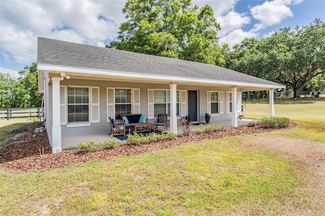 25601 Hutcheson Ln, Sorrento, FL 32776 - exterior space with a porch, a front lawn, a shingled roof, and fence